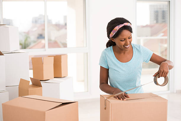 istock Woman packing for moving house. 621823486
