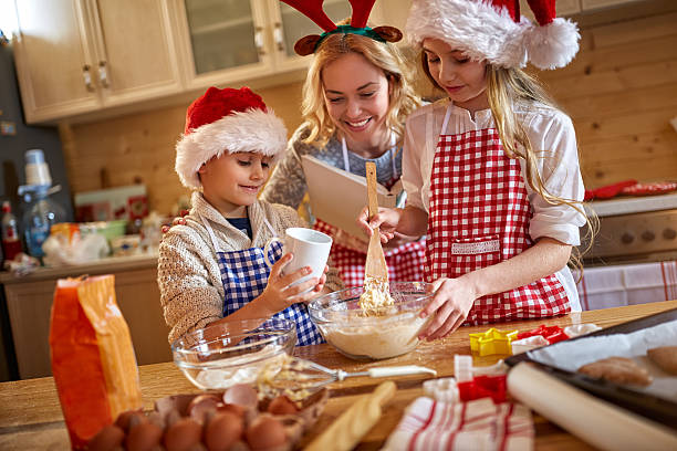 istock Family enjoying making Christmas cookies 621823550