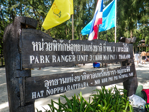 Koh Phi Phi, Thailand - November 15, 2012: The sign depicting the entrance to the famous destination Maya Bay, Koh Phi Phi, Krabi, Thailand.  This is a Public National Marine Park and Ranger Station.  Each year thousands of people visit Maya Bay Beach after it was made famous by the Leonardo Di Caprio Movie 'The Beach'.  