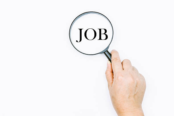 istock Unemployment concept with magnifying glass 621824584