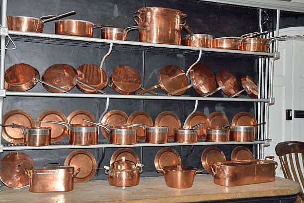 istock Shelves of antique copper cookware 621824646