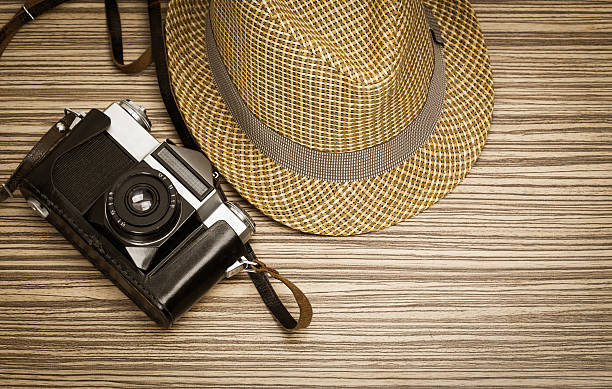 istock Vintage camera on wooden background 621825366