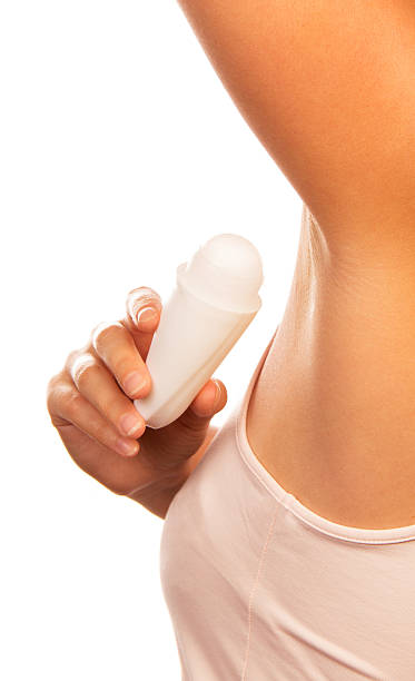 istock Woman applying deodorant isolated on white. 621826036