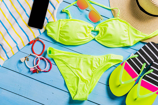 istock Beach accessories with yellow swimming suit 621826564