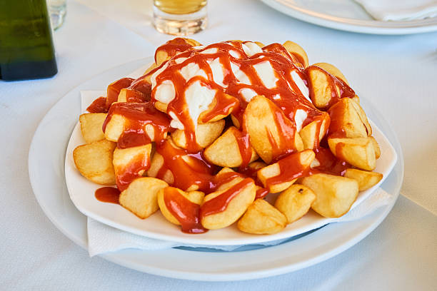 Bravas Bravas, potatoes with hot sauce from Spain. patatas bravas stock pictures, royalty-free photos & images