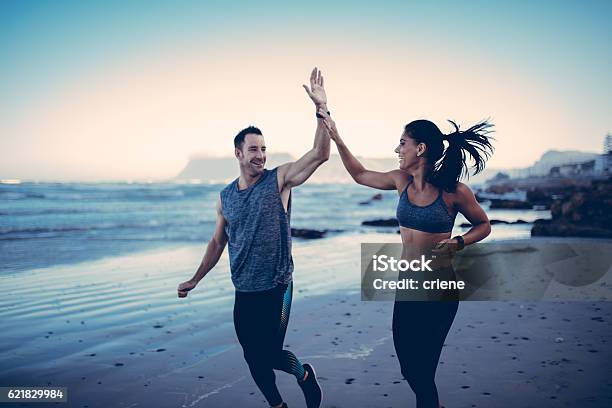 Fitness Couple Giving Each Other High Five After Hard Training Stock Photo - Download Image Now