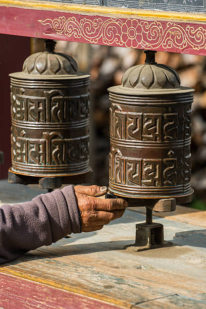 istock Buddhist prayer mani wall with prayer wheels 621832492