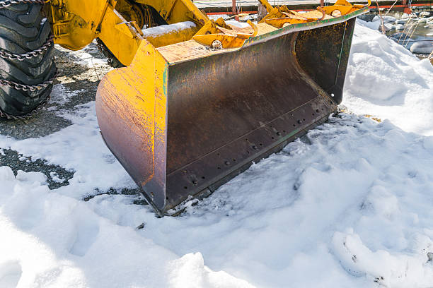 istock Tractor with snow plough in winter 621832786