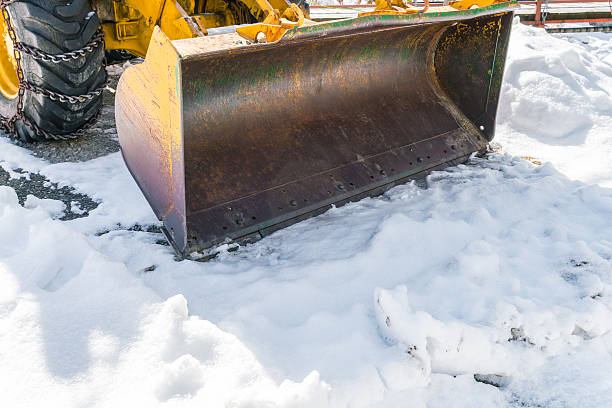 istock Tractor with snow plough in winter 621832858