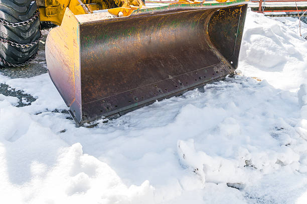 istock Tractor with snow plough in winter 621832942
