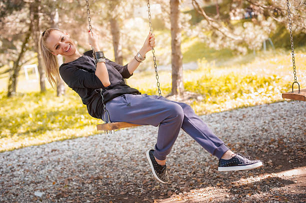 istock The woman on the swing 621833044