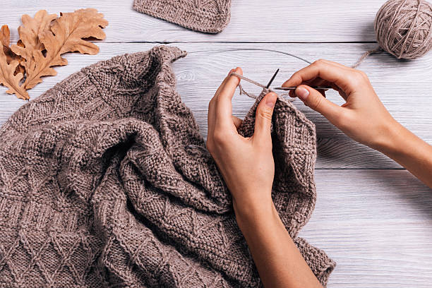 istock Female hand knit wool sweater 621833420