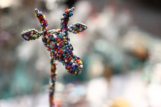 A handmade giraffe souvenir constructed with wire and beads is seen on a market stall in a South African handmade arts and crafts market