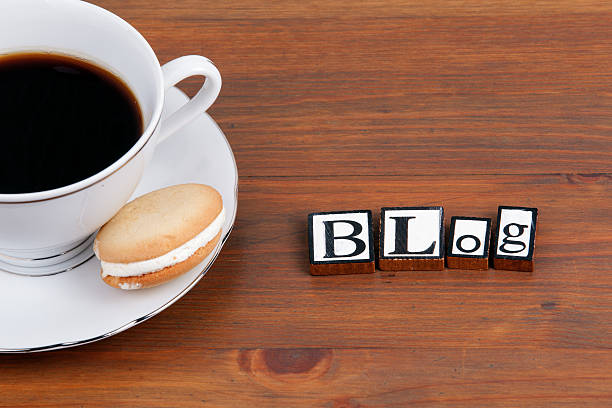 istock Coffee cup on a wooden table and text - Blog 621836598
