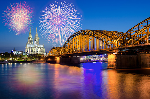 Cologne Cathedral and Hohenzollern Bridge with Fireworks on New Year day, Cologne, Germany.