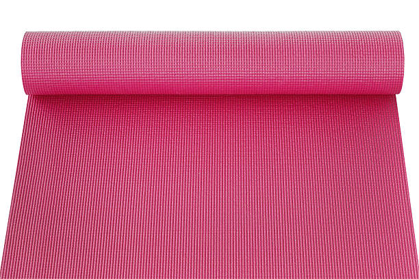 istock pink yoga mat isolated on white 621837600
