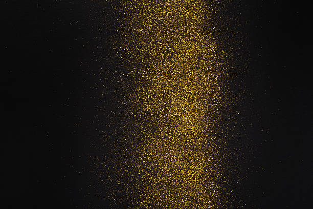 istock Golden glitter sand texture stripe on black, abstract background. 621838332
