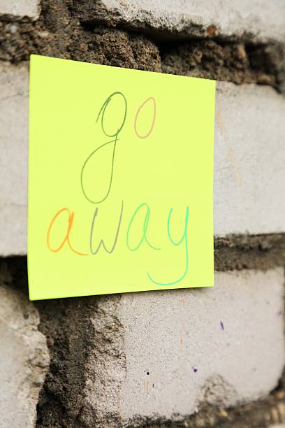 istock go away message on the sticker 621838374