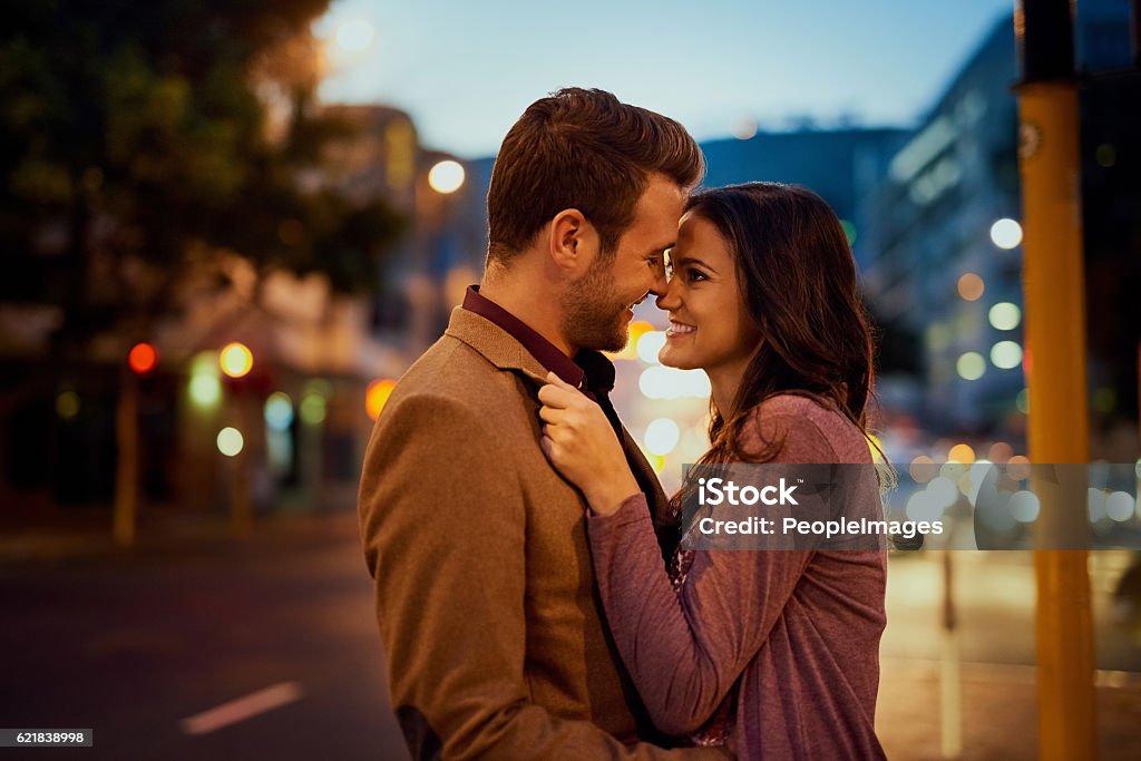 Who knew love could feel so amazing Cropped shot of an affectionate young couple enjoying a night out 20-29 Years Stock Photo