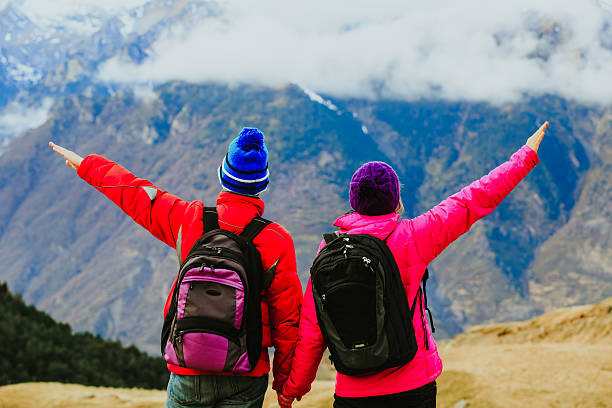 istock happy couple hiking in scenic mountains 621839598