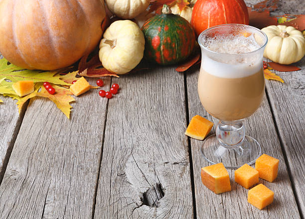 istock Pumpkin spice latte. Coffee cup on white wood background 621841234