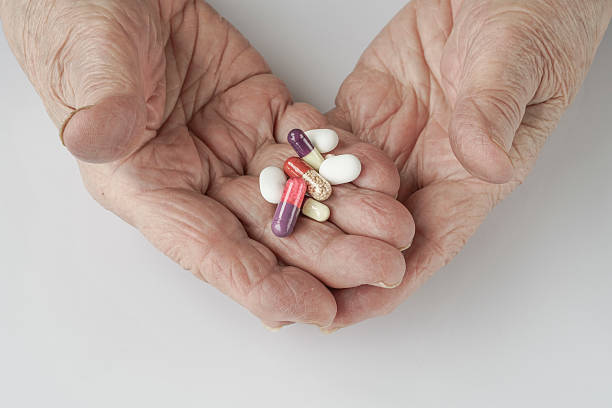 holding pills on palm stock photo