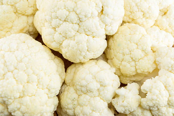istock Raw cauliflower on a pile forming background 621841602