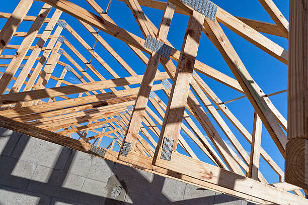 istock Roof Trusses on a Building Under Construction 621841660
