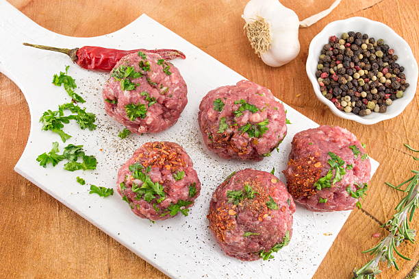 istock Raw meatballs ready for frying on a tray 621841750