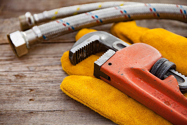 istock Set of plumbing and tools on the wooden table 621841852