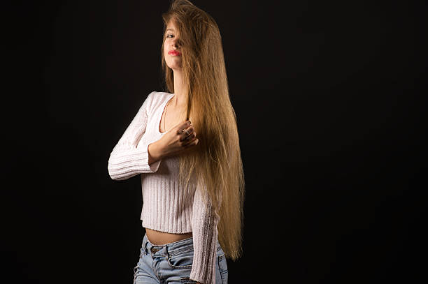 charming blond teenager girl with long hair - fashionable the human body short hair human head imagens e fotografias de stock