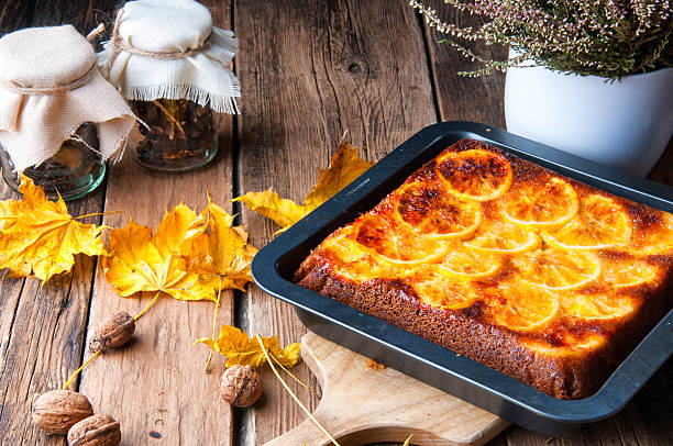 istock Delicious orange cake for autumn. Rustic decorations 621844182