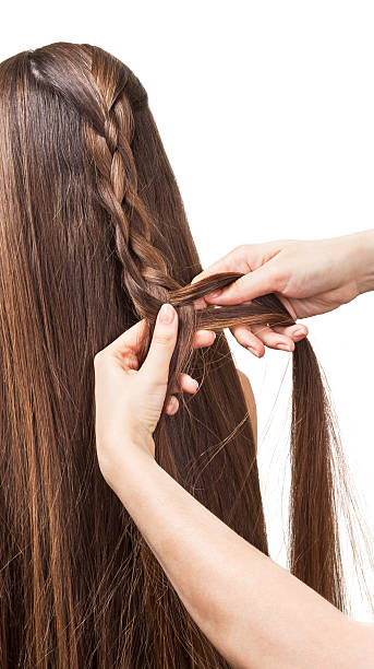 istock Long brown hair to weave into braid isolated on white. 621844252
