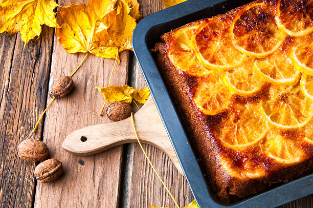 istock Delicious orange cake for autumn. Rustic decorations 621844396