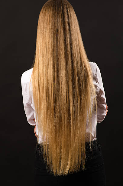 istock blond girl with long beautiful hair, back view 621844516