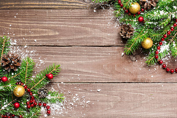 istock christmas fir tree on wooden background 621844790