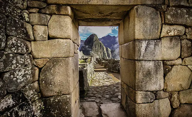 View of huayna Picchu through a stone gate of Machu Piccu