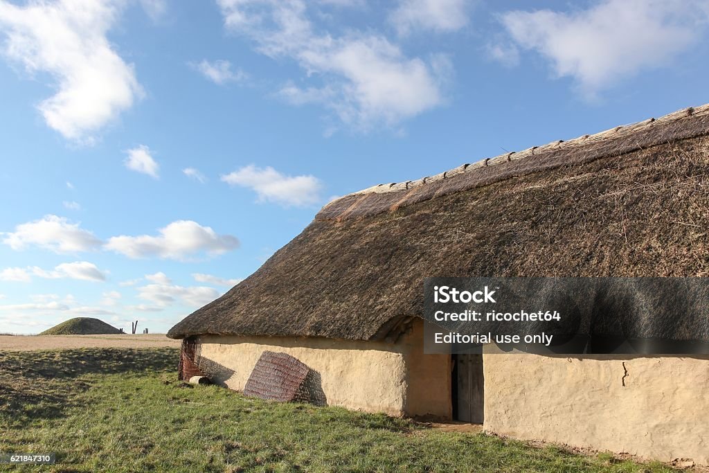 House and tumulus from Bronze age period, Borum Eshoj, Denmark Borum Eshoj, Denmark - February 15, 2016: House and tumulus from Bronze age period in Borum Eshoj, Denmark. Borum Eshøj is one of the country's largest barrows Ancient Stock Photo