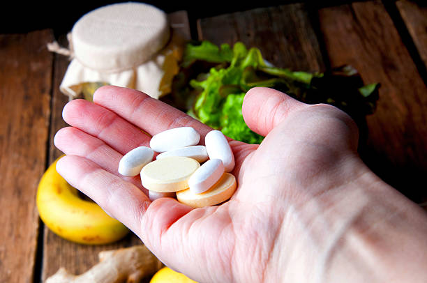 istock Choice between vitamins from supplements or from vegetables and fruits 621847400
