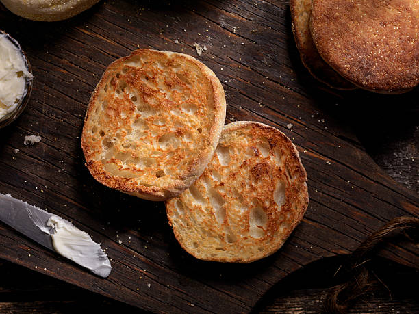 Toasted English Muffin with Butter Toasted English Muffin with Butter - Photographed on a Hasselblad H3D11-39 megapixel Camera System english muffin stock pictures, royalty-free photos & images