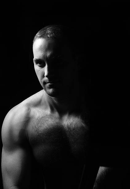 istock Portrait of muscular man sitting. 621848848