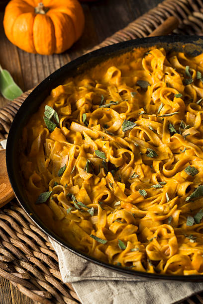 istock Homemade Autumn Pasta with Pumpkin Sauce 621850114