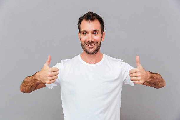 istock Happy casual man showing thumbs up 621850586