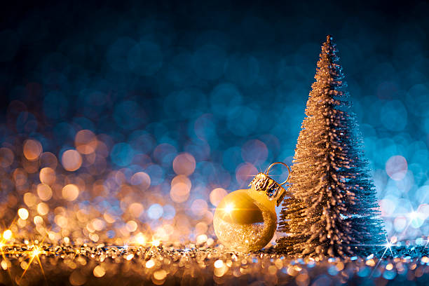 istock Christmas tree and ornament on defocused lights. Decorations Blue Gold 621851292