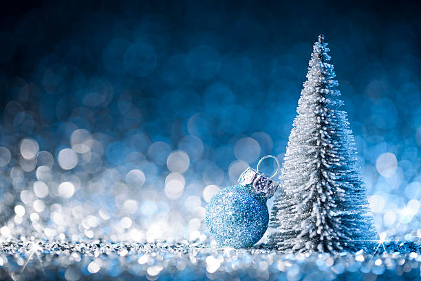 istock Christmas tree and ornament on defocused lights. Decorations Blue Gold 621851746