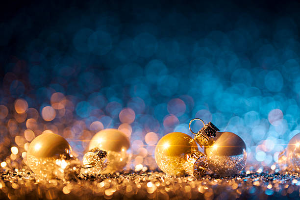 istock Christmas ornaments on defocused lights. Decorations Bokeh Blue Gold 621851920