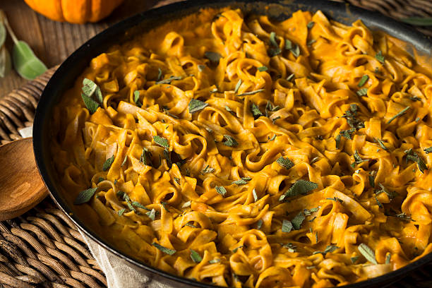 istock Homemade Autumn Pasta with Pumpkin Sauce 621852120