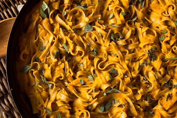 istock Homemade Autumn Pasta with Pumpkin Sauce 621852374