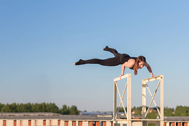istock Young woman doing yoga on the roof 621854532