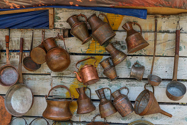 Ancient metal jugs in oriental style  in antique market